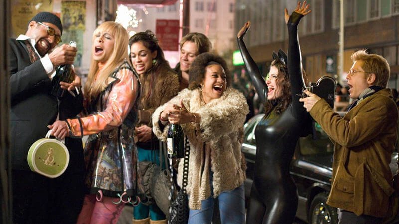 Still from "RENT" - The ensemble cast celebrate after breaking back into their squatter apartment