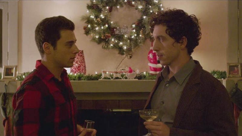 Shared Rooms 7 Still from "Shared Rooms" - Julian confesses his feelings for Dylan in front of a Christmas decorated mantle