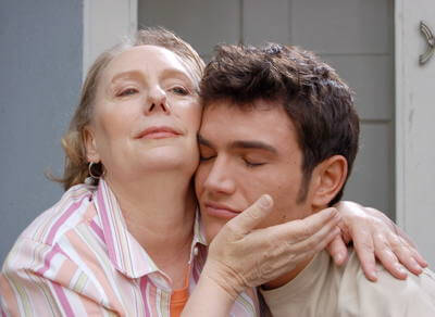 Still from “Eating Out 2: Sloppy Seconds” - Helen pulls her son, Kyle, close to her cheek in a hug