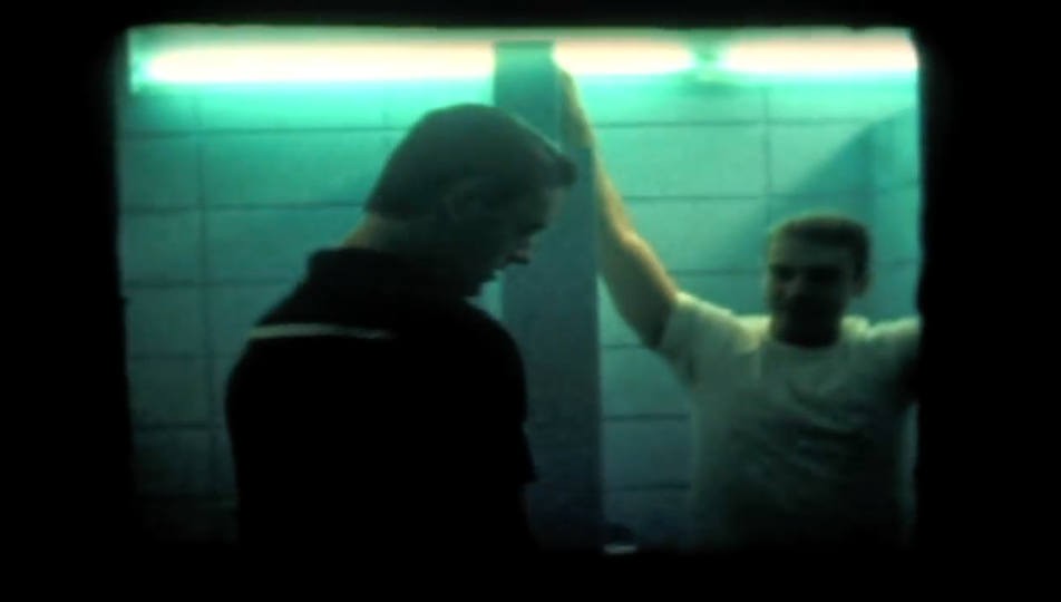 Still from "Caught" - Screencap of footage of cruising, caught on tape by cops