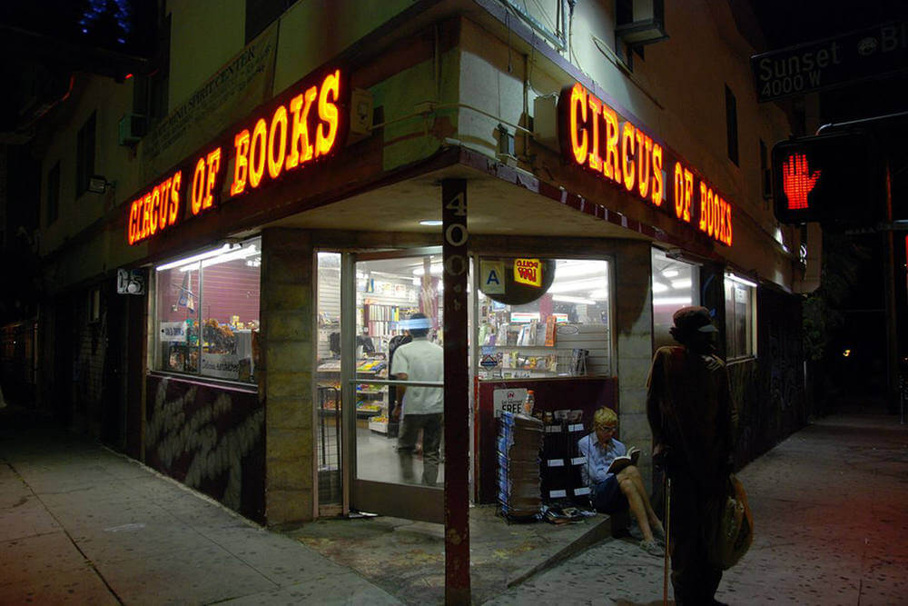 Still from "Circus of Books" - The outside corner storefront of Circus of Books with the neon lights